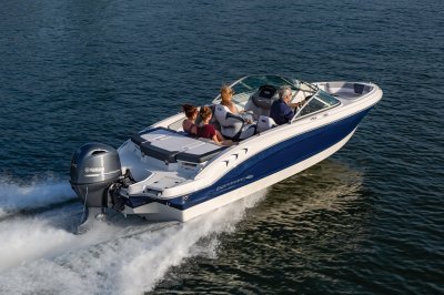 Chaparral 19 SSi OB cruising on a lake with four passengers rear starboard view. 