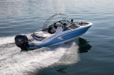 Chaparral 21 SSi OB cruising on a lake with four passengers rear starboard view. 