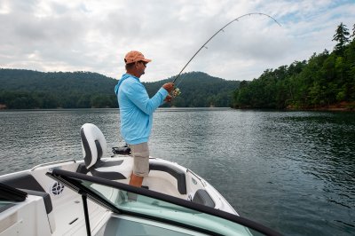 Chaparral 21 SSi OB Ski & Fish one passenger fishing on bow casting deck. 