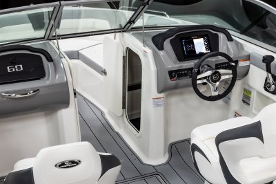 Chaparral 23 SSi latching storage compartment built into the helm of the boat. 