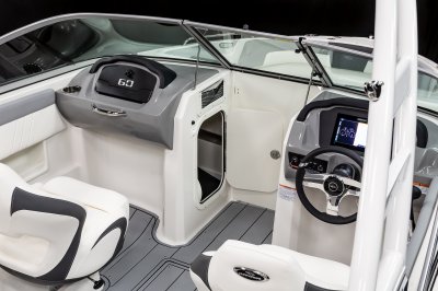 Chaparral 23 SSi locking glovebox and storage compartment built into the port console. 