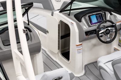 Chaparral 23 SSi latching storage compartment built into the helm of the boat 