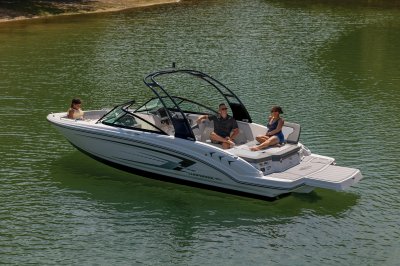 Chaparral 23 SSi one passenger on sun pad with three passengers in rear of boat 