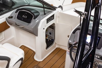 Chaparral GTS 3 port console has a storage compartment built in the bow walkway. 