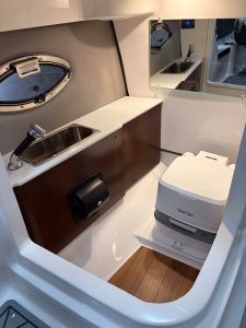 Chaparral GTS 6 port console head with compartment with locking door and overhead lighting 