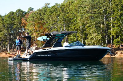 Chaparral GTS 6 two passengers on swim platform, one passenger at the helm 