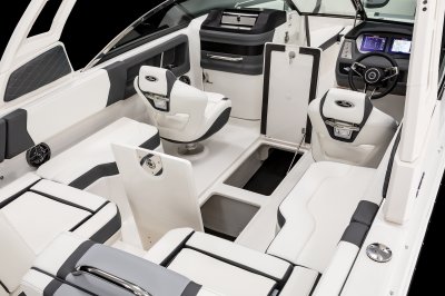 Chaparral 250 OSX twin floor storage lockers with metal struts to keep lids open. 