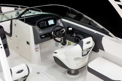 Chaparral 250 OSX helm station with captain's chair and tilting steering wheel. 