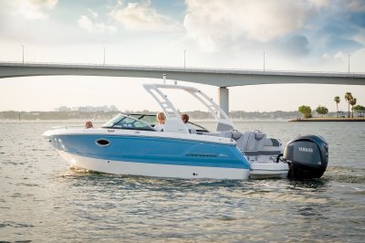 Chaparral 250 OSX idling toward a bridge at sunrise 