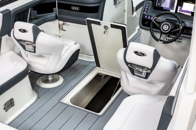 Chaparral 270 OSX in-floor storage locker with long compartment and draining mat. 