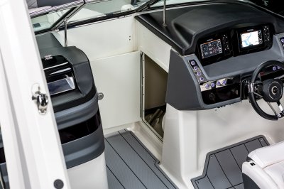 Chaparral 270 OSX helm storage compartment built into the bow walkway. 