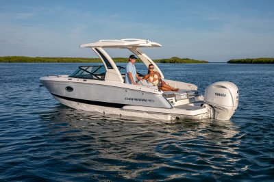 Chaparral 270 OSX stationary with passenger enjoying the lounge 