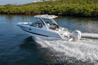 Chaparral 270 OSX running with one person at the helm and the other on the aft bench 