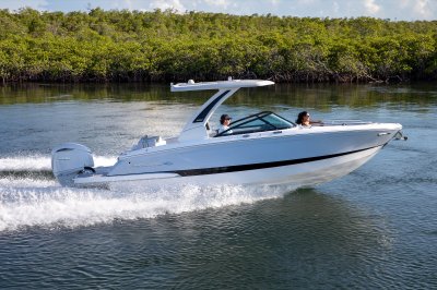 Chaparral 270 OSX running with one passenger in the bow and the captain at the helm 