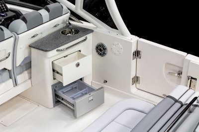 Chaparral 280 OSX cockpit wetbar with refrigerator and drawer opened. 