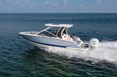 Chaparral 280 OSX cruising on the ocean rear port view. 