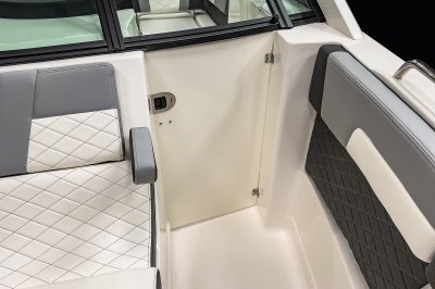 Chaparral 310 OSX one-piece weather door separates the bow from cockpit. 