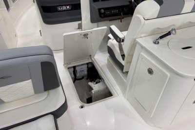 Chaparral 310 OSX in-floor storage with room for large items. 