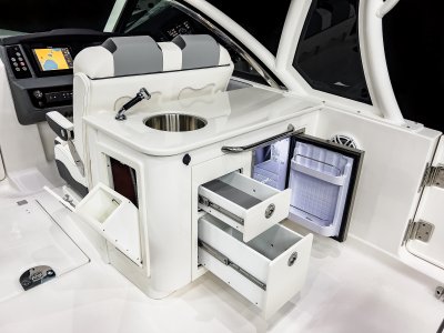 Chaparral 310 OSX wetbar includes 3 storage compartments and a standard refrigerator. 