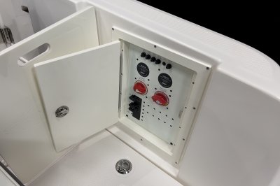 Chaparral 310 OSX battery switches behind door on starboard side walkway. 
