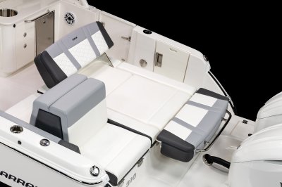 Chaparral 310 OSX aft bench seat folds out to provide aft-facing lounge. 