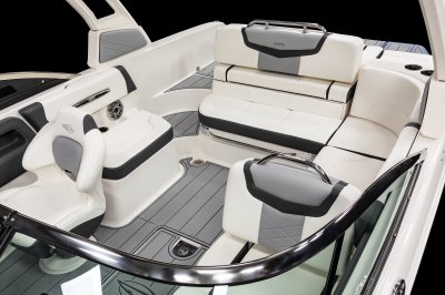 Chaparral 247 SSX port side console with a flip-back seat and bucket seat at the helm. 