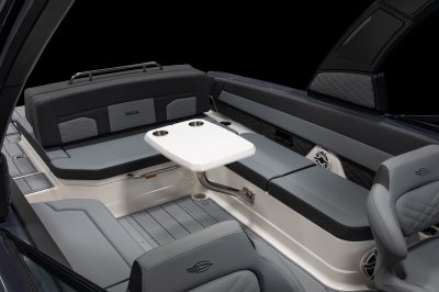Chaparral SSX 30 cockpit table mounted near bench seats with metal hardware. 