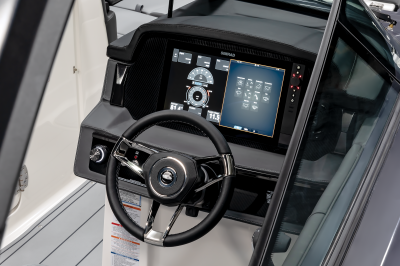 Chaparral SSX 30 close up of helm station dash with Simrad display. 