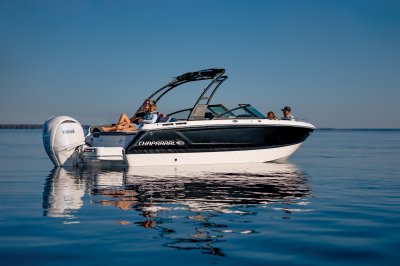 Chaparral SSX 4 OB two people lounging on aft lounge and two people in bow 