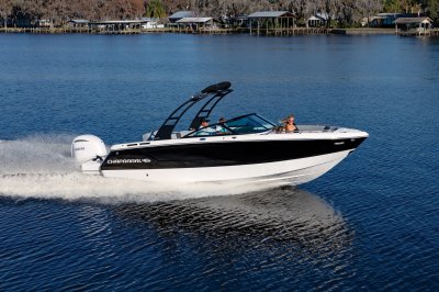Chaparral SSX 4 OB running on lake with houses in the background 