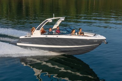 Chaparral 267 SSX cruising on lake with four women and two men front starboard view. 