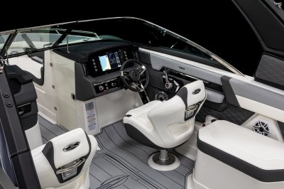 Chaparral 267 SSX helm station has touchscreens, bluetooth stereo, and metal control switches. 