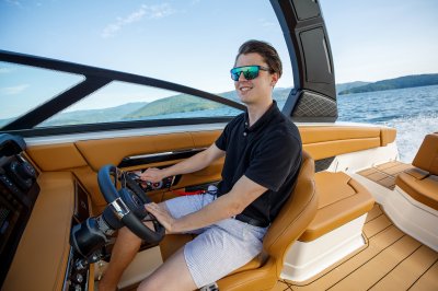 Chaparral SSX 8 driving on lake with captain at the helm 