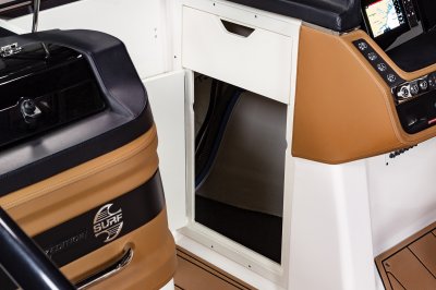 Chaparral 28 SURF helm console has a storage compartment built in the bow walkway. 