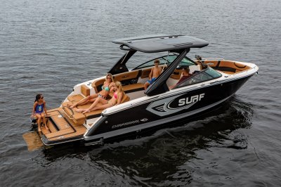 Chaparral 28 SURF anchored on a lake with a girl sitting on the Infinity Power Step. 