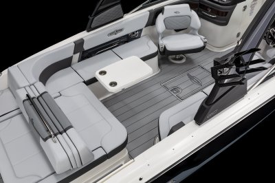 Chaparral 30 SURF table mounted on the port side with two cupholders and metal hardware. 