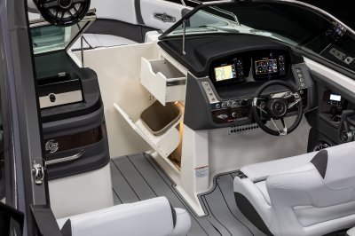 Chaparral 30 SURF helm console with fold-out trash can and drawer in the bow walkway. 