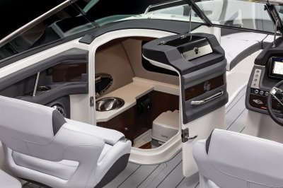 Chaparral 30 SURF head compartment with a sink, toilet, and a portligh 